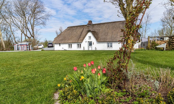 Augustenkoog Maison | Maison de vacances 'Reetdachhaus Alter Deich' avec sauna privé, jardin privé et 6 vélos électriques.