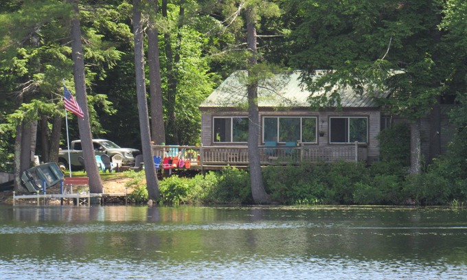 Pittsfield Maison | Vasha is a cozy pet-friendly lake house for relaxing in a secluded location.