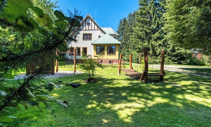 Mlade Buky Villa | Villa with an covered pool, park, and playground