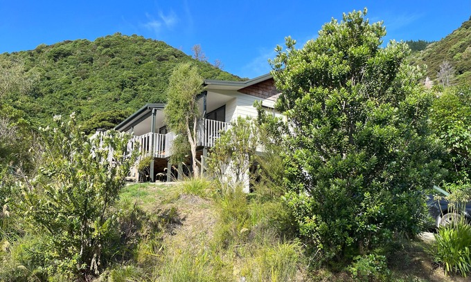 Waikawa Bay Maison | Waikawa Bay bach with spectacular harbour views and surrounded by native bush