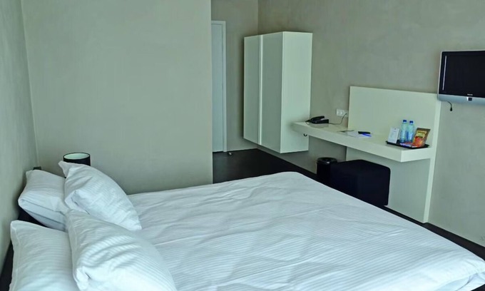 Monster Hôtel | Walk to the Beach from This Tropical Getaway — Free Parking Included