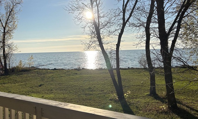 Saint Ambroise Cottage | Water's Edge cedar cabin on 1 acre lakefront: a perfect retreat winter or summer