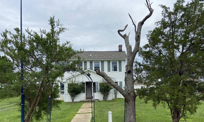 Piney Point Maison | Waterfront cottage with private pier, fireplace, and large yard.