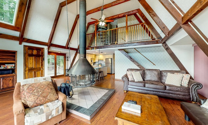 Barnstead Maison | Waterfront home with wraparound deck, floating fireplace, deck, & firepit