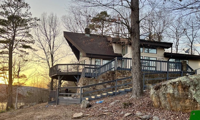 Center Ridge Maison | Watershed Getaway on lake, mountain behind house on property, and hiking trails
