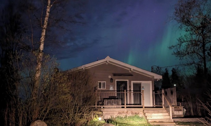 Tobermory Maison | Welcome to Sunset Cove — a serene waterfront cottage near Tobermory, where turquoise waters meet star-filled skies. Enjoy sunsets, Northern Lights, a private dock, and cozy nights by the fire. Your unforgettable escape awaits.
