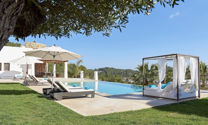 Sant Carles de Peralta Villa | Wonderful Ibiza Villa | Villa Norbert | 4 Bedrooms | Spacious Furnished Sun Terrace | Private Outdoor Infinity Pool | BBQ Facilities | Shaded Outdoor Dining Area | Outdoor Kitchen | Private Garden | Private Indoor Hot Tub and Sauna | Santa Eulalia