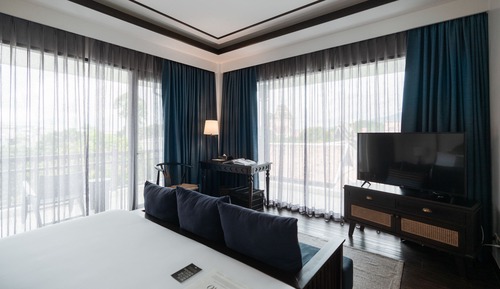 Chambre Deluxe, 1 très grand lit, en angle