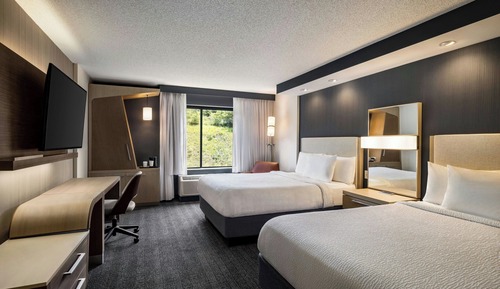 Chambre, plusieurs lits