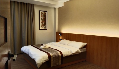 Chambre Deluxe, 1 grand lit, non-fumeurs, accès piscine