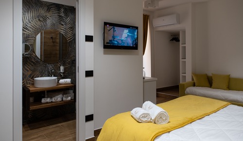 Chambre Quadruple Deluxe, non-fumeurs, salle de bains attenante
