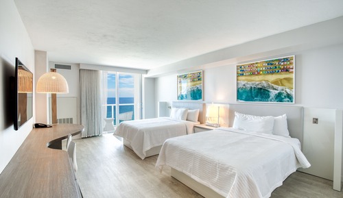 Chambre, 2 grands lits, en front de mer