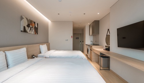 Chambre Familiale avec lits jumeaux (1 Room)