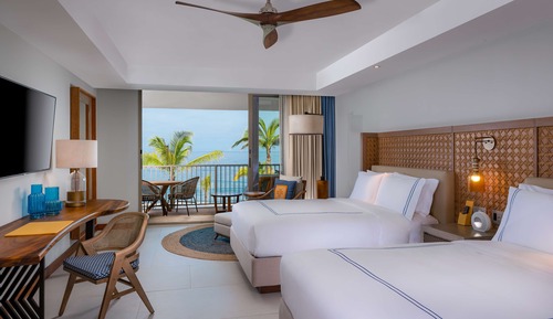 Chambre, 2 grands lits, en front de mer