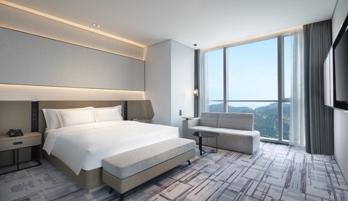 Chambre Standard, 1 très grand lit, accès au salon club, vue océan