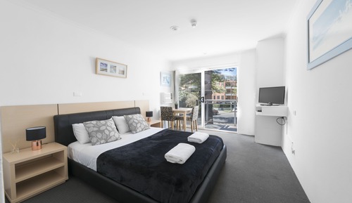 Suite Deluxe, 1 grand lit, balcon, vue partielle sur l'océan