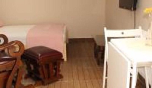 Chambre Triple Élite, plusieurs lits, vue jardin