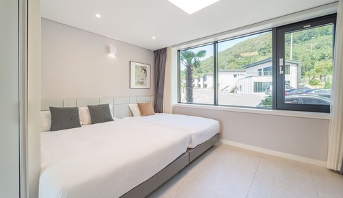 Chambre avec lits jumeaux, vue océan