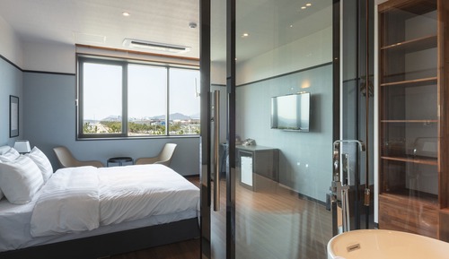 Chambre Double Deluxe, 1 très grand lit, salle de bains privée