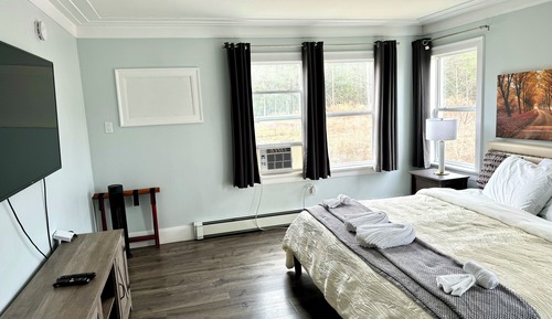 Suite Deluxe, 1 très grand lit, non-fumeurs, réfrigérateur et four à micro-ondes