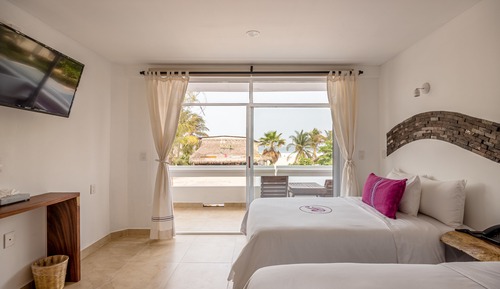 Chambre Deluxe, 2 lits doubles, vue partielle sur la mer