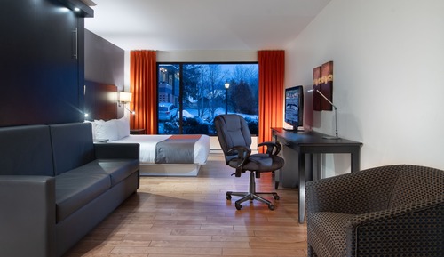Chambre Design, 2 grands lits, réfrigérateur et four à micro-ondes