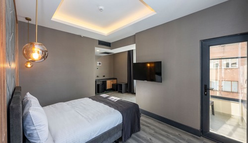 Chambre Deluxe, 1 lit double, balcon, vue ville