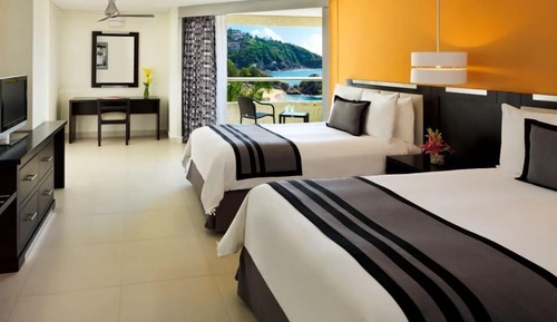 Chambre Deluxe, 2 lits doubles, vue partielle sur la mer