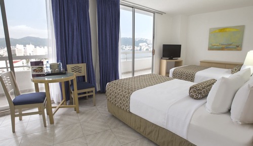 Suite Junior, 2 lits doubles, balcon, vue partielle sur l'océan