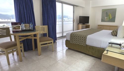 Suite Junior, 1 très grand lit, balcon, vue partielle sur l'océan