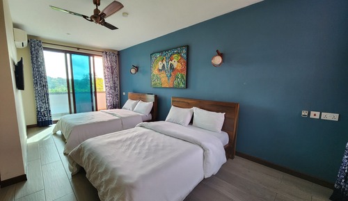Chambre Deluxe avec lits jumeaux, 2 lits doubles, vue jardin, côté jardin