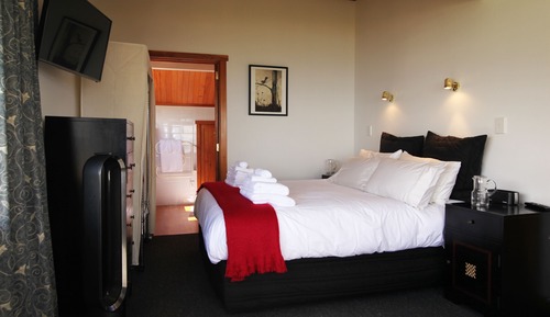 Suite, 1 grand lit, vue plage (Piwakawaka)