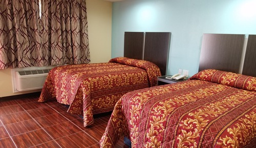 Chambre, plusieurs lits