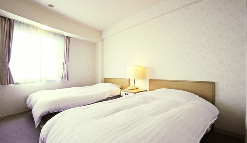 Chambre avec lits jumeaux, vue mer