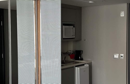 Agua Verde Appartement | Complete studio in Batel, Wi-Fi, kitchen and dining/work table