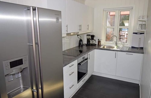 Lindesnes Maison | Holiday home 'Furuholmen Brygge 7', Furuholmen peninsula near Lindesnes, southern Norway, up to 7 people possible, e.g. 4 adults and 3-4 kids, 4 bedrooms, 2 shower-bathrooms, modern equipment, terrace and boat mooring in front of the house on the .