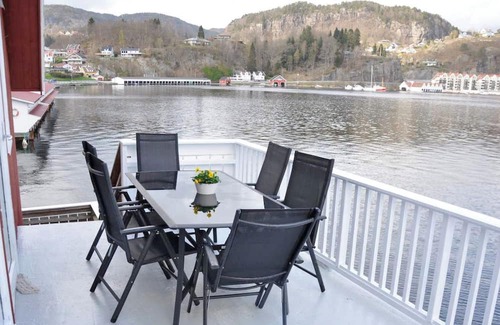 Flekkefjord Appartement | Holiday apartment "Fagerstrand 1", in Flekkefjord, southern Norway, in a beautiful location directly on the water, 4-6 persons, open living-dining area, 2 bedrooms, 1 loft with double mattress, 1 bathroom, Internet, own small veranda with access t...
