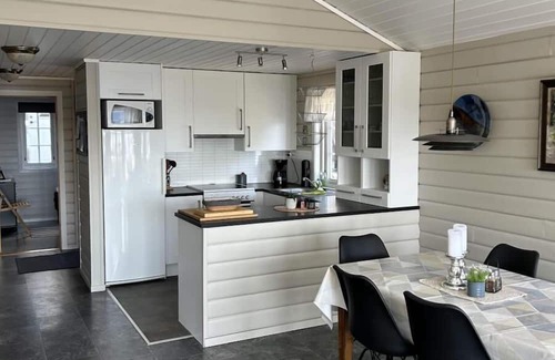 Lindesnes Maison | Holiday home Mona in Lussevika, new addition 2024, near Spangereid-Lindesnes, southern Norway, , max. 6 adults, own boat mooring, approx. 100 m² living space, 3 bedrooms, charming and tasteful furnishings, large veranda with fjord view, terrace f.