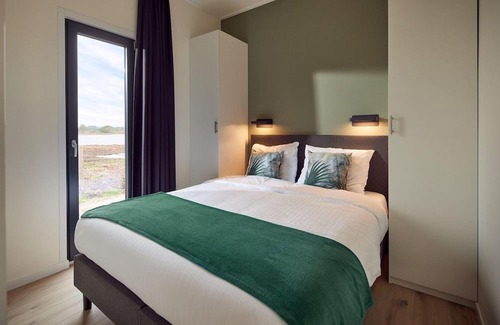 Lattrop Maison | This holiday home for six persons has a spacious living room with an open kitchen, three bedrooms and a spacious patio.