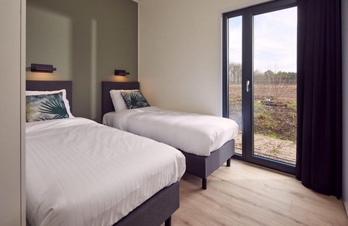 Lattrop Maison | This holiday home for six persons has a spacious living room with an open kitchen, three bedrooms and a spacious patio.