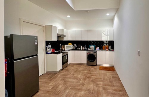 Doha Appartement | Heart of Doha Elegant Home with Shared Swimming Pool