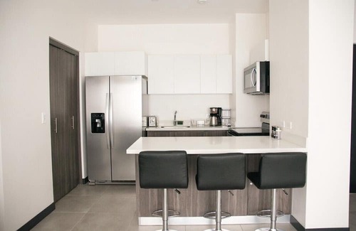 Guacima Copropriété | Great apartment near the Airport with Air Condit.