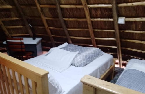 Western Region Autre | White Cat Farm Hut Inn is nestled on the outskirts of a quaint African village