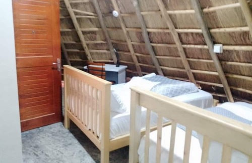 Western Region Autre | White Cat Farm Hut Inn is nestled on the outskirts of a quaint African village