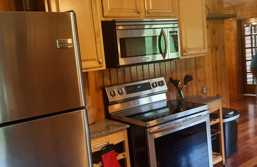 Elkton Autre | Log cabin style duplex on 150 acres of beautifully serene wooded farmland
