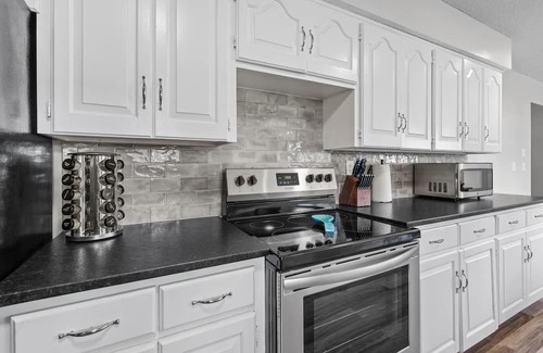 Joplin Maison | Stylish Rancher in Quiet, Tree Lined Neighborhood.