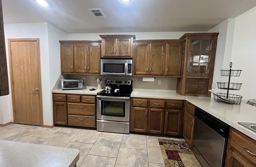 Spiro Maison | Upscale home with high end furnishings and memory foam king bed. 2 car garage