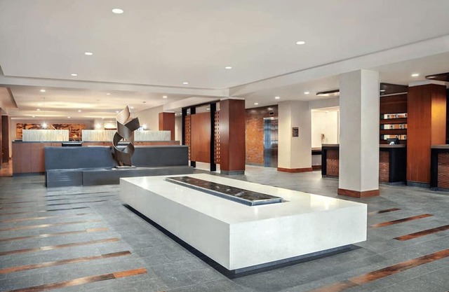 2 Connecting Suites with Two Beds and One Sofabed at a Full Service Hotel by Suiteness
