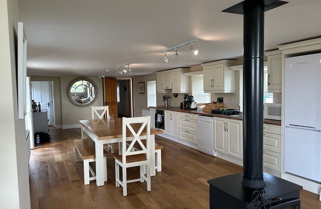 Gorgeous renovated farmhouse with sweeping views of lush farmland!