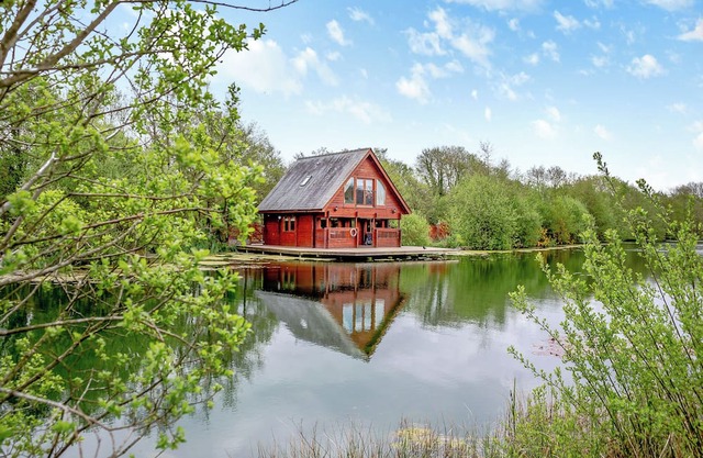 Set in a peaceful location and perched over the lake.